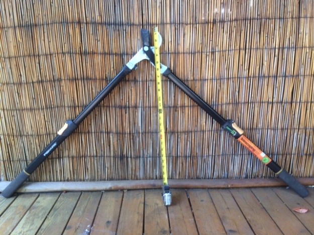 My extendable Fiskars. In the above the jaws are open to accept a 1" branch. The tape measure indicates a 25" reach while the outside of the grips are 50" apart. You can see how these might be hard to use in more congested plants.