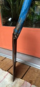 Blade set at a nearly flat angle to handle