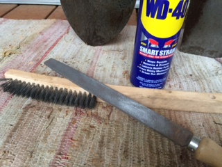 WD-40, 10" File and a wire brush...the essentials